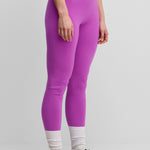 woman wearing bright pink cashmere leggings.