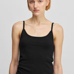 woman wearing a black fitted cotton cashmere strap top with a round neckline.