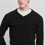 man wearing a black cashmere v-neck sweater.