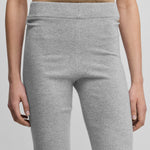 woman wearing light grey cashmere biker shorts with ribbed elasticated waistband.