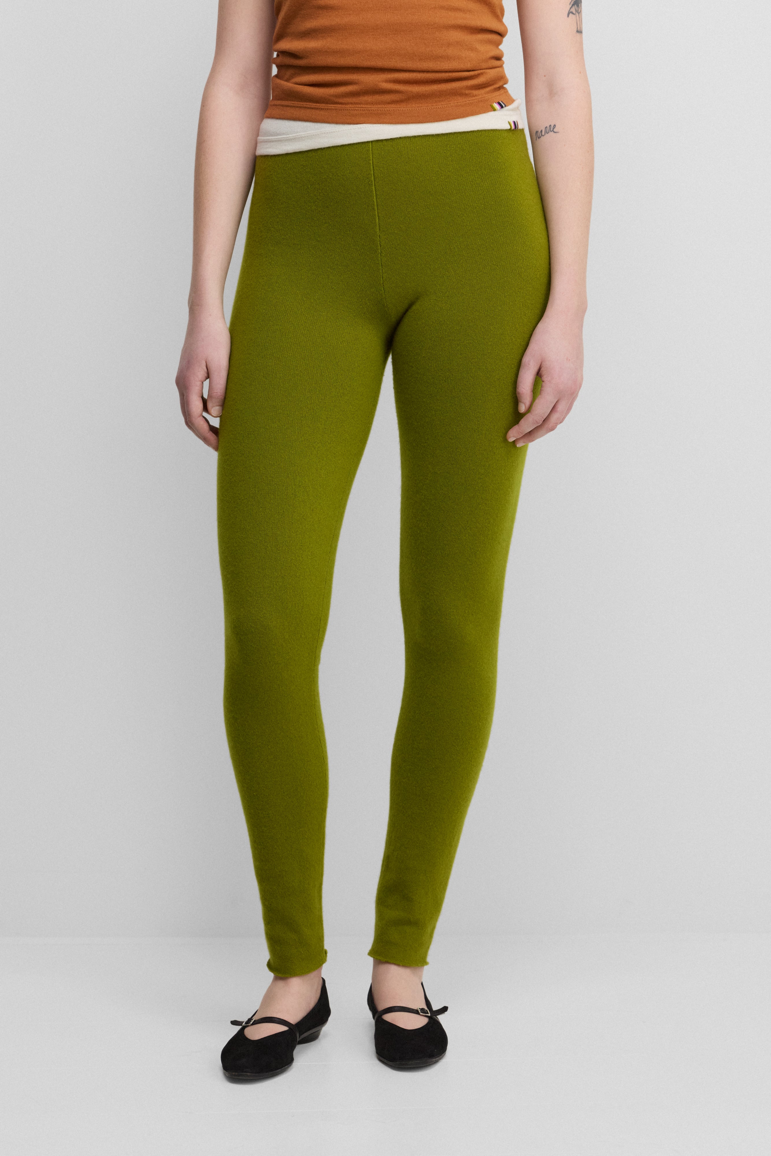 woman wearing green cashmere leggings.