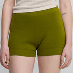 woman wearing fitted green cotton cashmere rib-knit shorts.