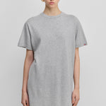woman wearing a light grey cotton-cashmere mini t-shirt dress.