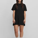 woman wearing a black cotton-cashmere mini t-shirt dress.