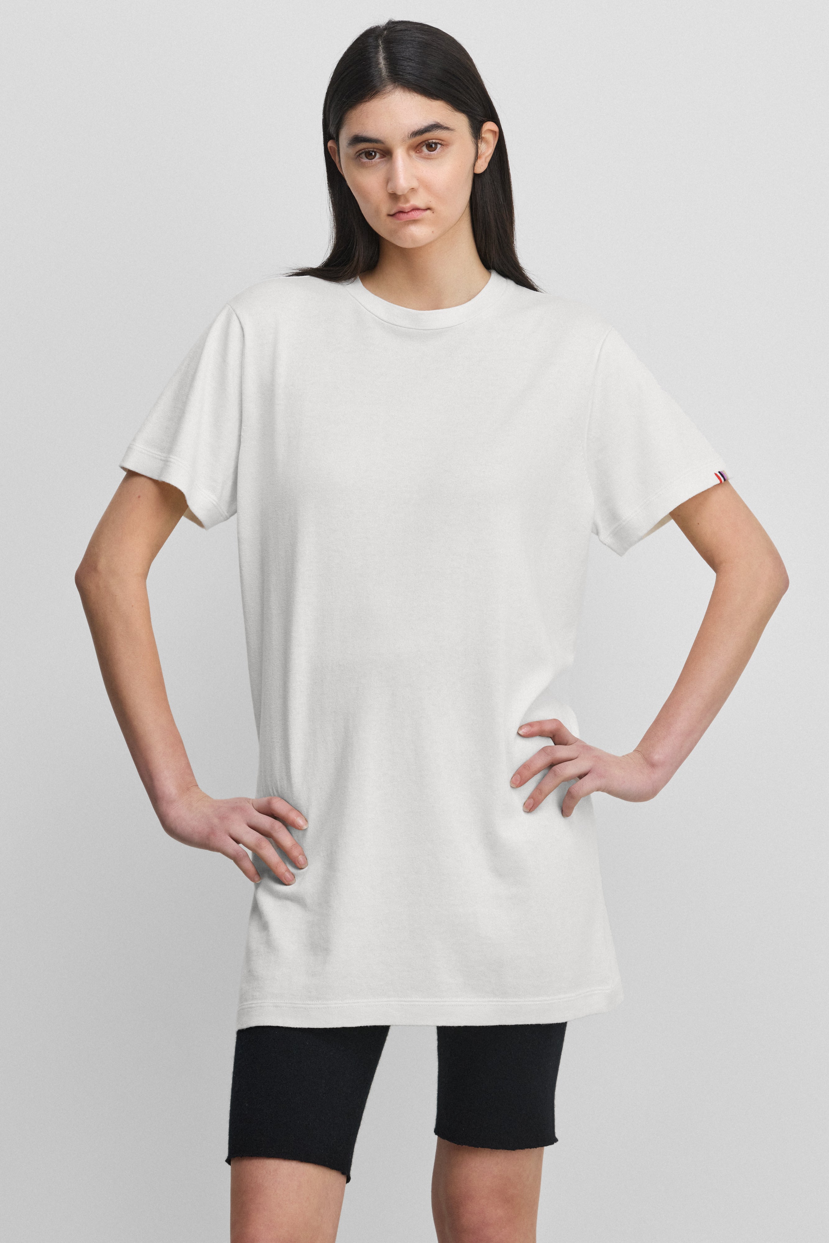 woman wearing a whitecotton-cashmere mini t-shirt dress.