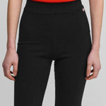 woman wearing black cashmere biker shorts with ribbed elasticated waistband.