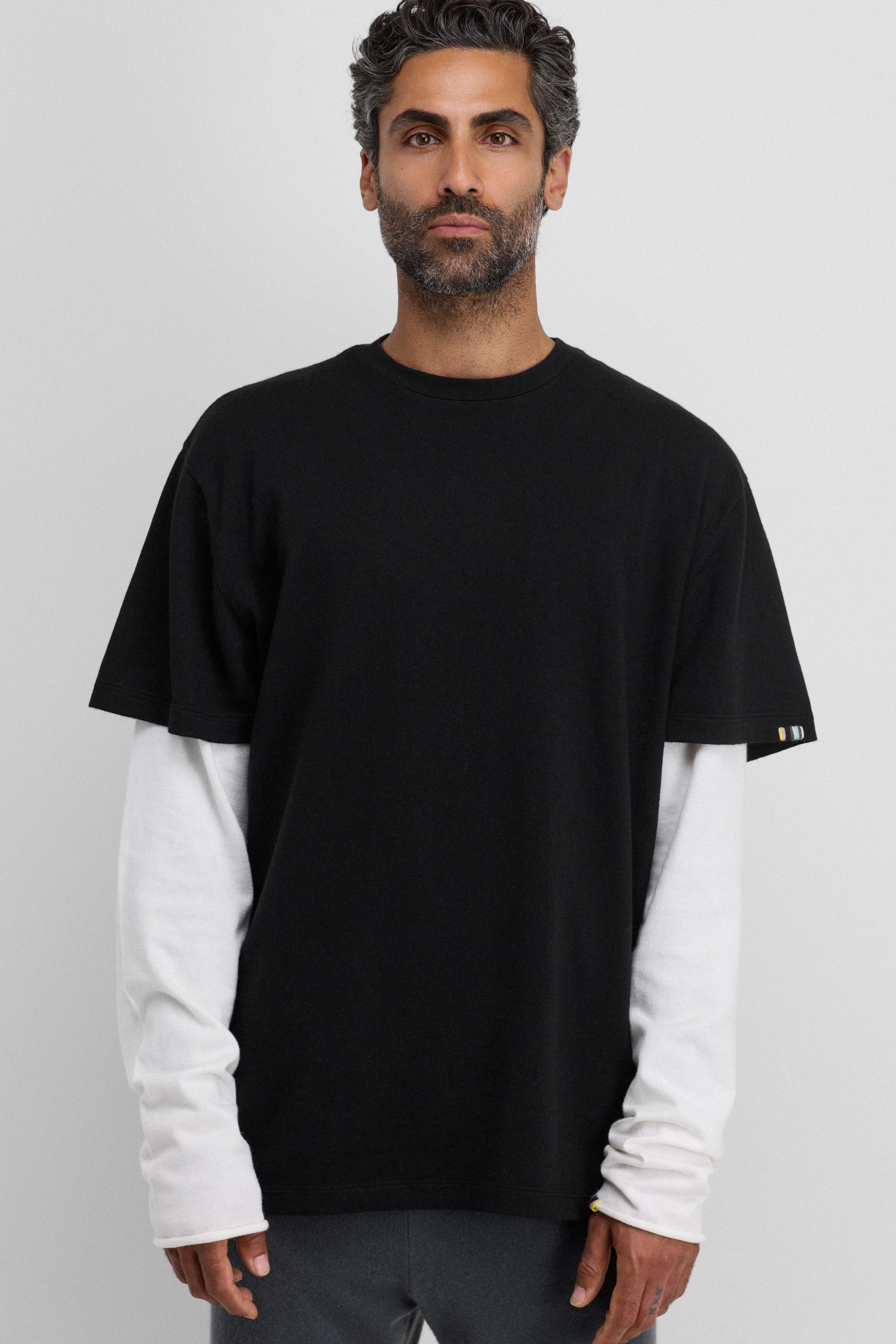 man wearing a black oversized short-sleeved cotton-cashmere crewneck t-shirt.