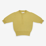 yellow short-sleeved half-button cashmere sweater, laid flat.
