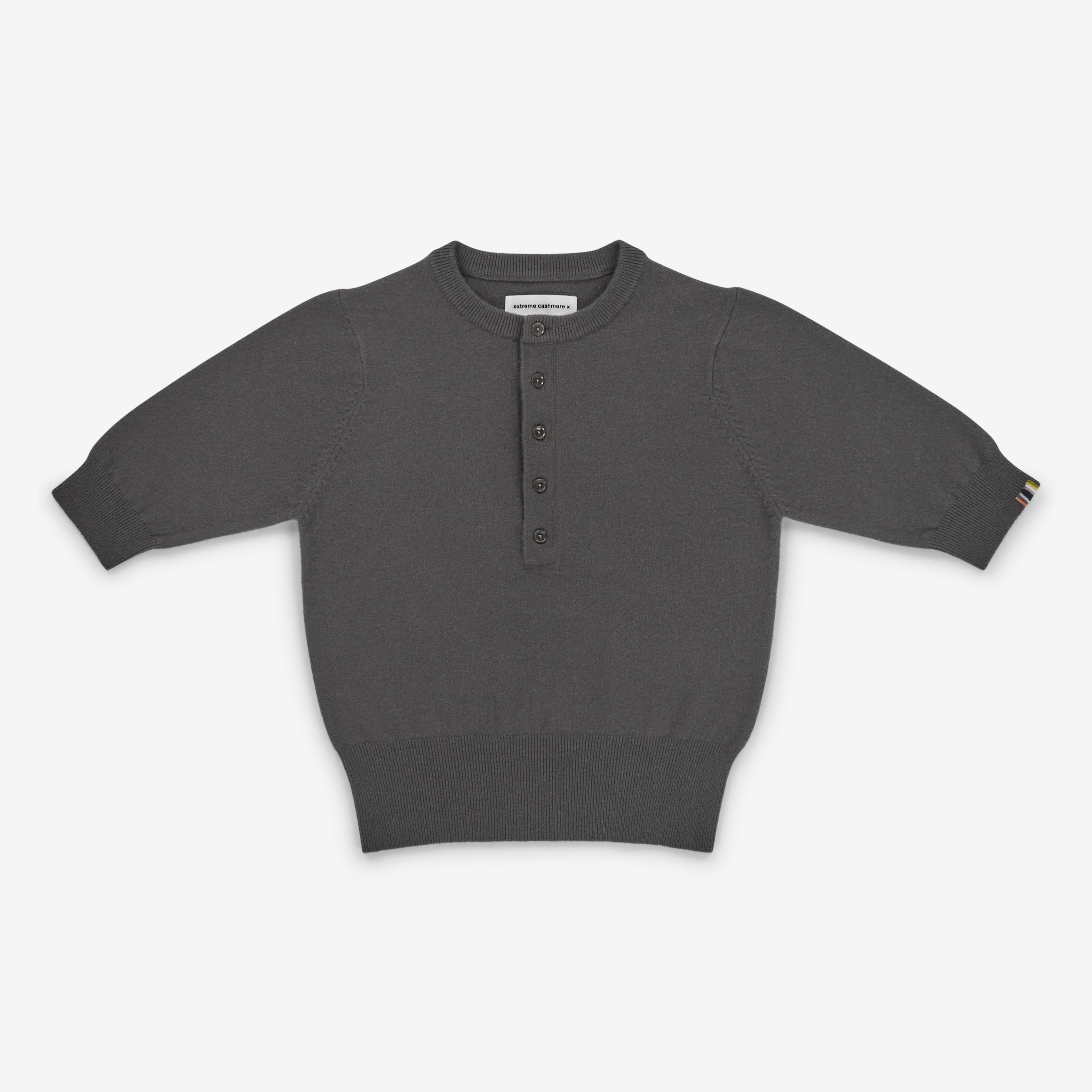 dark grey short-sleeved half-button cashmere sweater, laid flat.