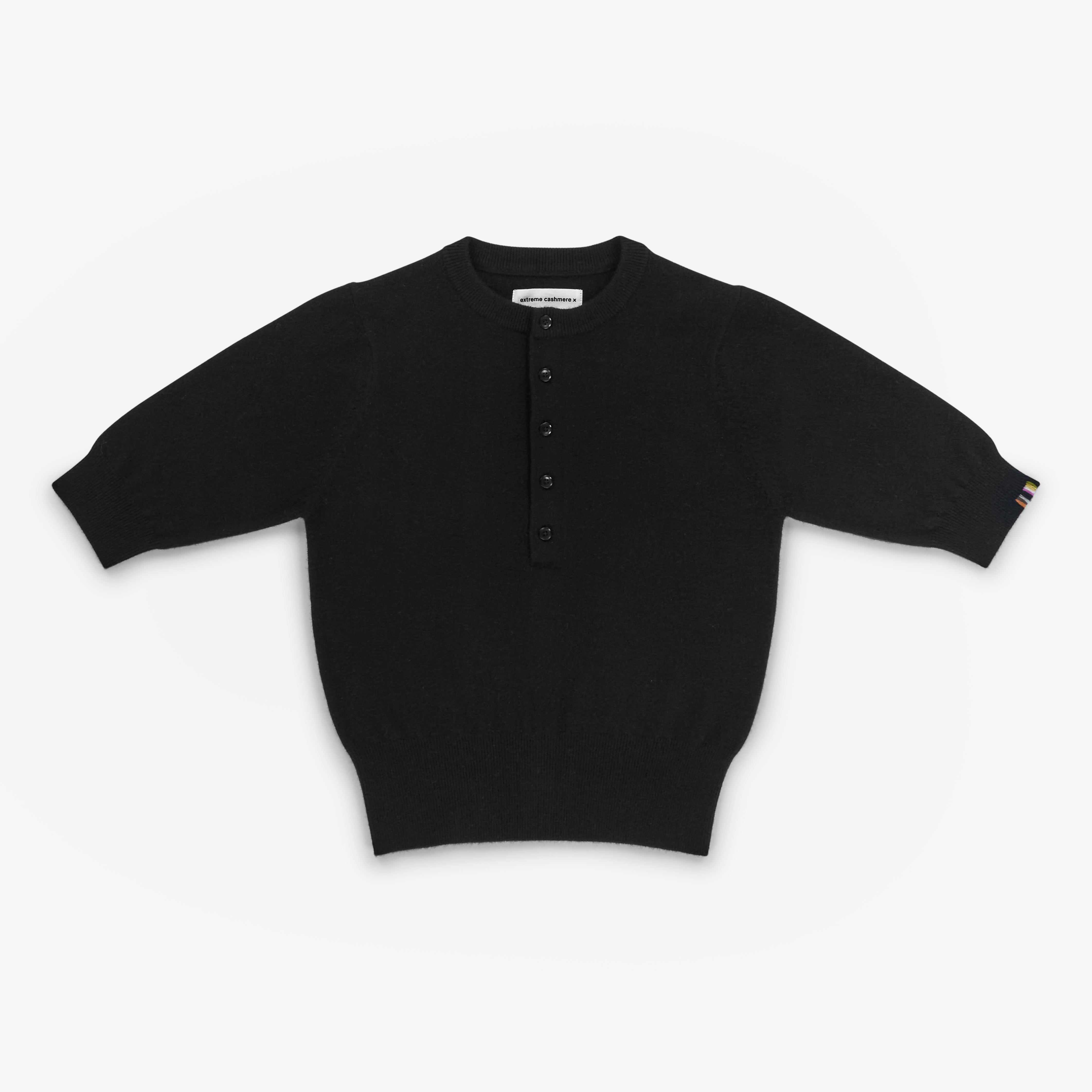 black short-sleeved half-button cashmere sweater, laid flat.