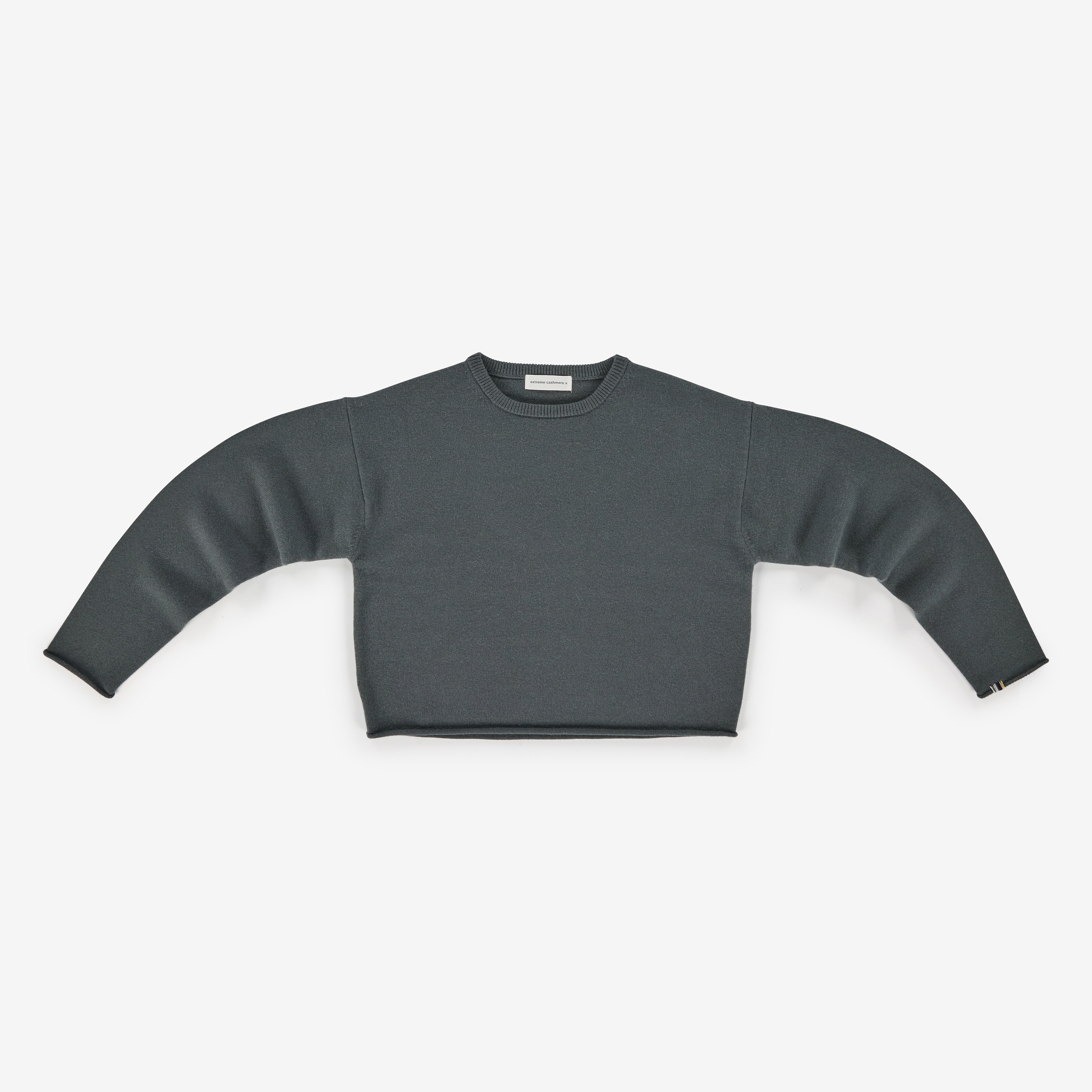 dark grey cashmere crew-neck sweater with a boxy silhouette, laid flat.